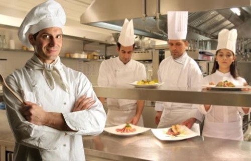 four-chefs-in-white-with-plates